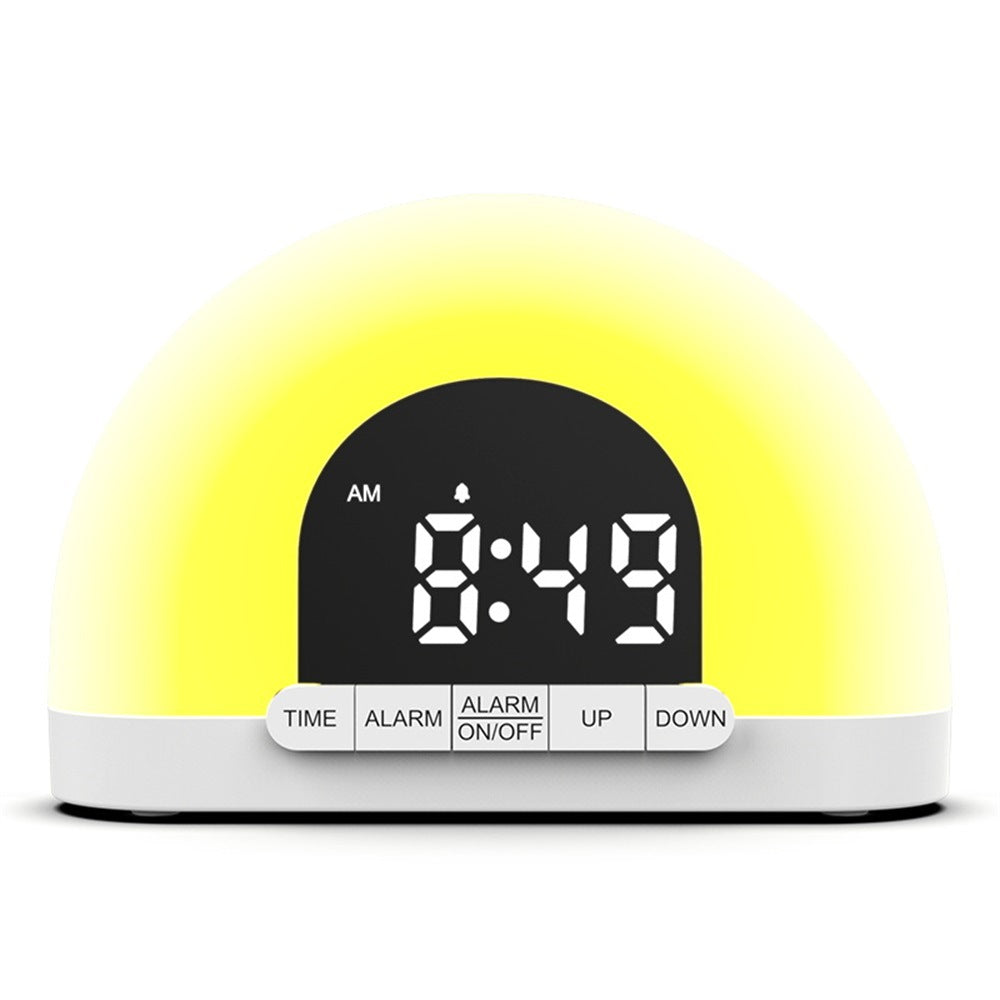 Wake-up light sunrise alarm clock, front view, glowing amber light with digital time display