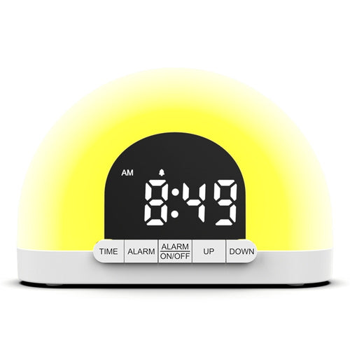 Wake-up light sunrise alarm clock, front view, glowing amber light with digital time display